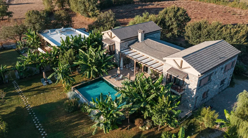 Aerial view of Turunç House Kayaköy with a private pool, lush garden, and serene surroundings.